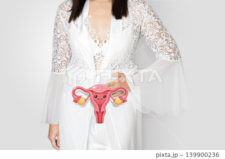 Healthy Uterus Cartoon Concept with Woman in White Nightgown Healthy Uterus Cartoon Concept with Woman in White Nightgown 139900236