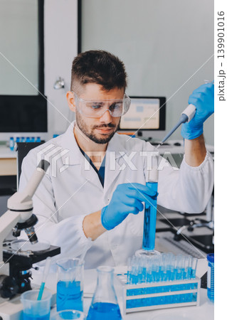 Lab technician experimenting in lab Lab technician experimenting in lab 139901016