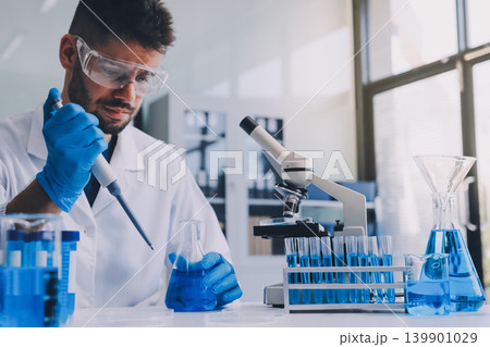 Lab technician experimenting in lab 139901029