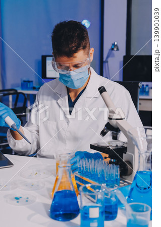 Lab technician experimenting in lab 139901039
