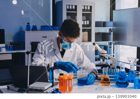 Lab technician experimenting in lab Lab technician experimenting in lab 139901040