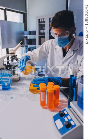 Lab technician experimenting in lab Lab technician experimenting in lab 139901041