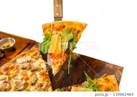 Top view of hand with pizza Pie Server Pizza Truffle and mushroom, pizza Rucola and parmesan, focus selective Top view of hand with pizza Pie Server Pizza Truffle and mushroom, pizza Rucola and parmesan, focus selective 139902464