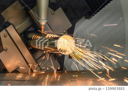 High-precision hole making process on a stainless steel pipe using an advanced fiber laser cutting machine. High-precision hole making process on a stainless steel pipe using an advanced fiber laser cutting machine. 139903881