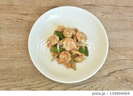stir fried green pea and mushroom topping shrimp in soybean sauce on plate stir fried green pea and mushroom topping shrimp in soybean sauce on plate 139904004