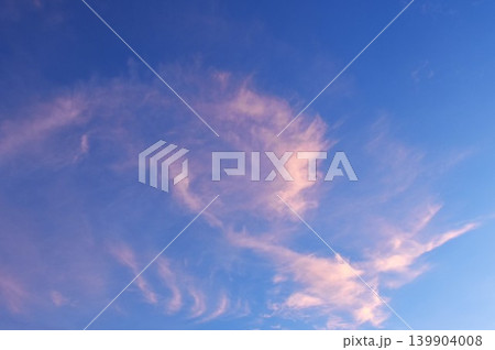 white cloud spreading on twilight sunset blue sky in evening 139904008