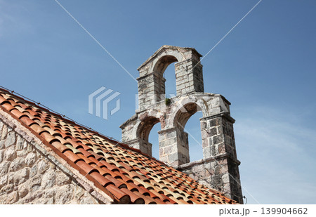The bell tower of the church of Saint Mary in Punta, Budva, Montenegro The bell tower of the church of Saint Mary in Punta, Budva, Montenegro 139904662