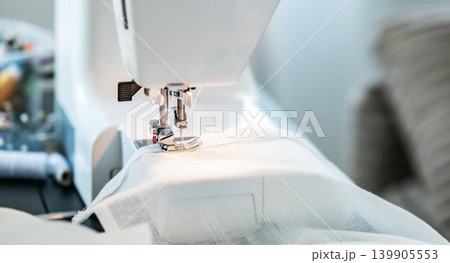 Close View of Sewing Machine Working on Fabric 139905553