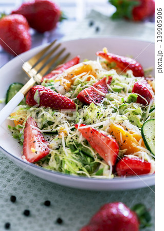 Salad with young cabbage and strawberries. 139905906