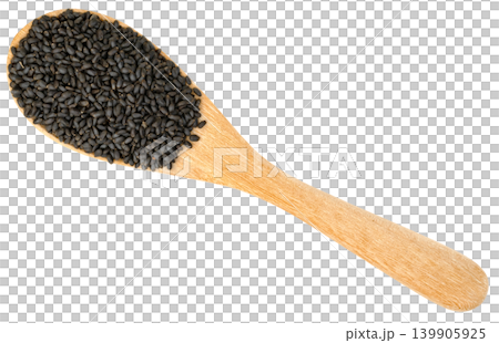 Top view of a wooden spoon overflowing with black basil seeds isolated. This image represents healthy food ingredients, superfoods, and holistic wellness concepts. Top view of a wooden spoon overflowing with black basil seeds isolated. This image represents healthy food ingredients, superfoods, and holistic wellness concepts. 139905925