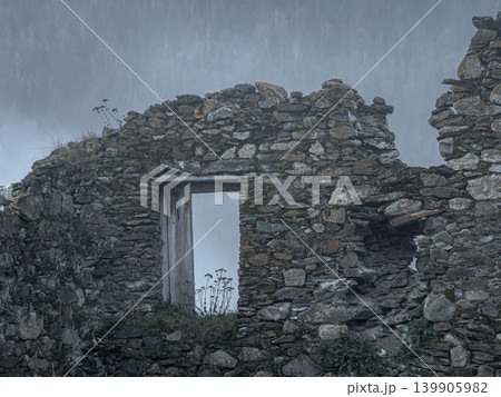 ancient masonry of a defense tower, stone walls of ancient ruin. 139905982