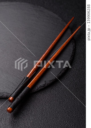 Empty slate board with wooden chopsticks for Asian food. Empty slate board Empty slate board with wooden chopsticks for Asian food. Empty slate board 139906288