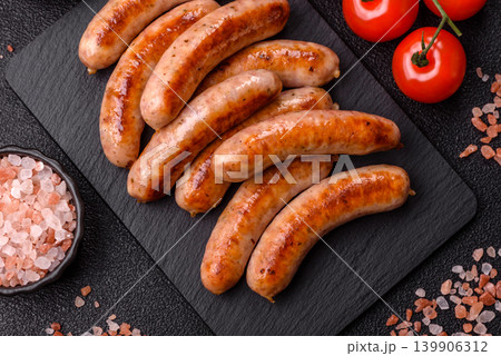 Grilled or barbecued chicken sausages for the dinner table. Grilled sausages 139906312