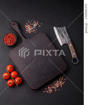An empty wooden cutting board, kitchen utensils for food preparation. An empty cutting board An empty wooden cutting board, kitchen utensils for food preparation. An empty cutting board 139906355