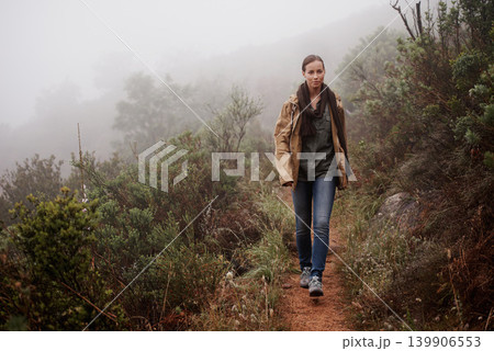 Portrait, travel and woman in nature for hiking, wellness or morning walk outdoor in winter. Path, trekking and female person in a forest for fresh air, camping or adventure, journey or campsite fun 139906553