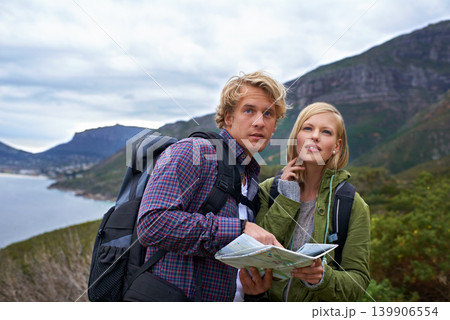 Couple, thinking and map on mountain for hiking, direction or location on outdoor adventure together in nature. Young man and woman reading tour or travel guide for route, path or destination on hike 139906554