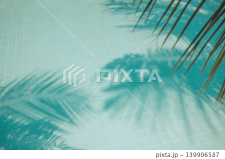 Abstract summer swimming pool closeup water surface palm leaf shadow relaxing tropical background sunshine tranquil outdoor poolside breathtaking stunning dreamy serene luminous ethereal vibrant Abstract summer swimming pool closeup water surface palm leaf shadow relaxing tropical background sunshine tranquil outdoor poolside breathtaking stunning dreamy serene luminous ethereal vibrant 139906587