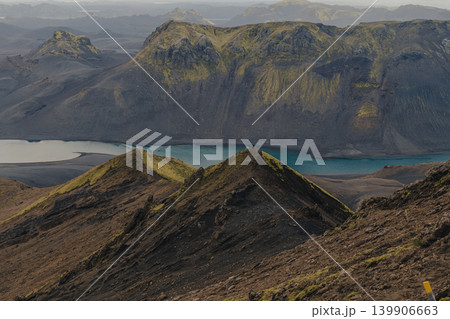 Volcanic Landscape with Turquoise River and Mossy Peaks in Iceland Volcanic Landscape with Turquoise River and Mossy Peaks in Iceland 139906663