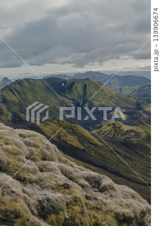 Moss Covered Mountains and Valleys in Iceland Under Cloudy Sky Moss Covered Mountains and Valleys in Iceland Under Cloudy Sky 139906674