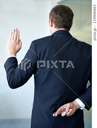 Businessman, back and fingers crossed with luck of liar for hope, confidential or secret at office. Rear view of man or business employee hiding hand in conspiracy, lie or swear for truth or honesty Businessman, back and fingers crossed with luck of liar for hope, confidential or secret at office. Rear view of man or business employee hiding hand in conspiracy, lie or swear for truth or honesty 139906865