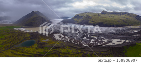 Aerial View of Icelandic Glacier with Moss Covered Mountains Aerial View of Icelandic Glacier with Moss Covered Mountains 139906907