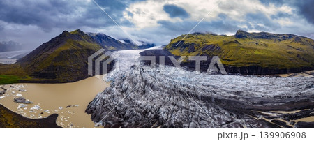 Aerial View of Icelandic Glacier and Glacial Lagoon with Ice Chunks Aerial View of Icelandic Glacier and Glacial Lagoon with Ice Chunks 139906908