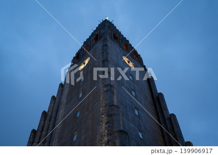Hallgrimskirkja Facade Illuminated Against a Dusky Blue Sky Hallgrimskirkja Facade Illuminated Against a Dusky Blue Sky 139906917