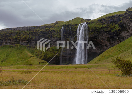 Seljalandsfoss Waterfall Cascading from Moss Covered Cliff in Iceland 139906960