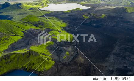 Aerial View of Volcanic Landscape with Moss and Reflective Lake in Iceland Aerial View of Volcanic Landscape with Moss and Reflective Lake in Iceland 139906984