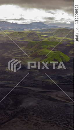 Aerial View of Iceland's Volcanic Landscape with Moss Covered Hills Aerial View of Iceland's Volcanic Landscape with Moss Covered Hills 139906995