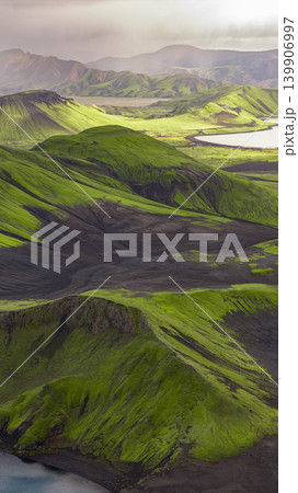 Aerial View of Iceland's Volcanic Landscape with Moss Covered Hills Aerial View of Iceland's Volcanic Landscape with Moss Covered Hills 139906997