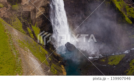 Aerial View of Icelandic Waterfall with Turquoise Pool and Mossy Cliffs Aerial View of Icelandic Waterfall with Turquoise Pool and Mossy Cliffs 139907046