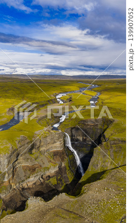 Aerial View of Waterfall and Canyon in Iceland's Mossy Landscape 139907052