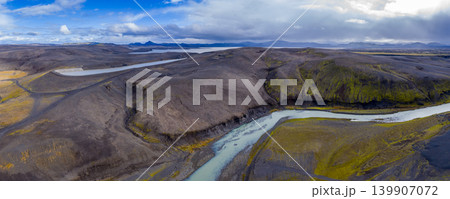 Aerial View of Iceland's Volcanic Landscape with River and Hills Aerial View of Iceland's Volcanic Landscape with River and Hills 139907072