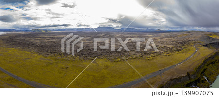 Aerial View of Volcanic Landscape with Road and River in Iceland Aerial View of Volcanic Landscape with Road and River in Iceland 139907075
