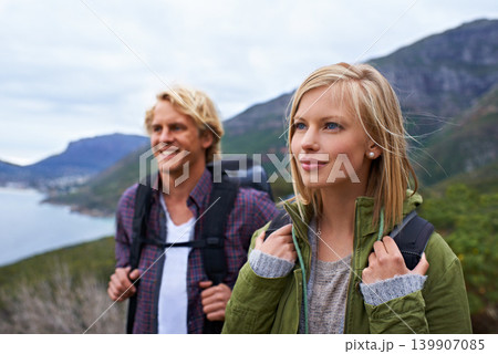 Happy couple, hiking and backpack on mountain for sightseeing, travel or outdoor journey in nature. Face of young man, woman or hikers carrying bag on back for trekking, fitness or adventure in woods Happy couple, hiking and backpack on mountain for sightseeing, travel or outdoor journey in nature. Face of young man, woman or hikers carrying bag on back for trekking, fitness or adventure in woods 139907085