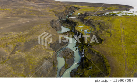 Aerial View of Turquoise River and Waterfalls in Icelandic Canyon Aerial View of Turquoise River and Waterfalls in Icelandic Canyon 139907097