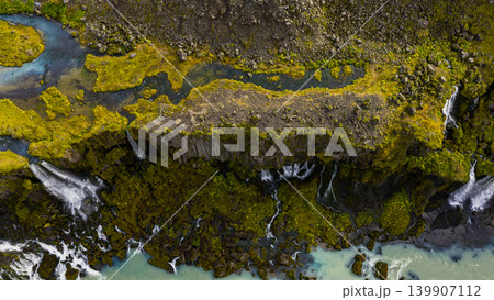Aerial View of Cascading Waterfalls and Turquoise River in Iceland 139907112