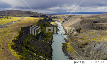 Aerial View of a Deep Canyon with River and Mossy Cliffs in Iceland 139907114