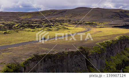 Aerial View of Icelandic Cliffside with Volcanic Terrain and Dirt Road Aerial View of Icelandic Cliffside with Volcanic Terrain and Dirt Road 139907124