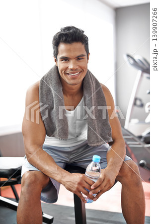 Happy, man and portrait at gym with water bottle for recovery after exercise and body building. Healthy, fitness or person relax after workout with liquid hydration for benefits to wellness in Mexico 139907266