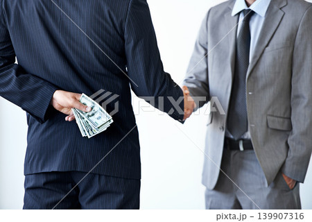 Handshake, deal with corruption and business people in meeting, illegal partnership and fraud with money laundering. Agreement, collaboration and payment for crime with bribery on white background 139907316