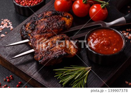 Chicken or turkey, poultry breast baked on the grill or barbecue. Grilled chicken 139907378