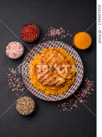 Kabsa or haneeth, an Arabic dish with rice and chicken, salt, and spices. Kabsa or haneeth 139907458