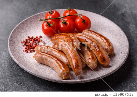 Grilled or barbecued chicken sausages for the dinner table. Grilled sausages Grilled or barbecued chicken sausages for the dinner table. Grilled sausages 139907515