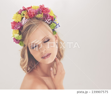 Woman, face and flowers on crown in studio with makeup and confidence for cosmetics, beauty and skincare. Spring aesthetic, model and floral headband with mockup space or wellness on white background Woman, face and flowers on crown in studio with makeup and confidence for cosmetics, beauty and skincare. Spring aesthetic, model and floral headband with mockup space or wellness on white background 139907575