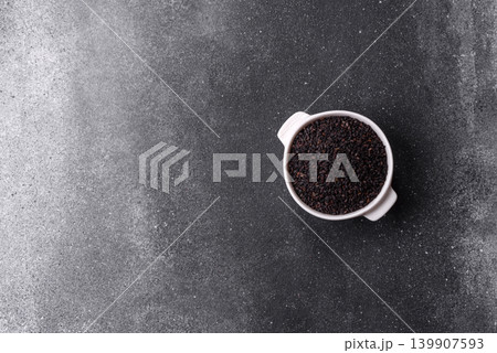 Black sesame seeds in a bowl, an ingredient for oil and healthy eating. Black sesame 139907593
