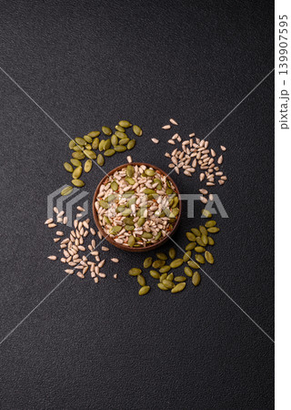 Shelled sunflower, sesame, pumpkin, and flaxseed kernels as ingredients for healthy food 139907595