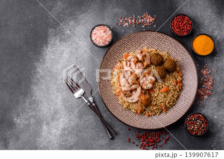Kabsa or mandi, an Arabic dish with rice and chicken, salt, and spices. Kabsa or mandi Kabsa or mandi, an Arabic dish with rice and chicken, salt, and spices. Kabsa or mandi 139907617