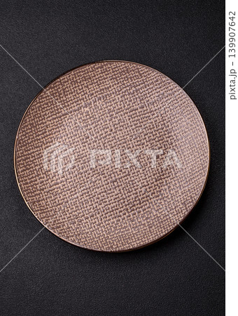 An empty ceramic round plate, kitchen utensils for a dinner table. An empty plate An empty ceramic round plate, kitchen utensils for a dinner table. An empty plate 139907642